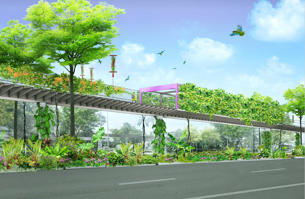 A green skywalk covered with plants and trees, over a road with lush foliage, under a clear blue sky with birds flying.